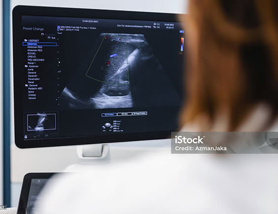A doctor reviewing medical scans